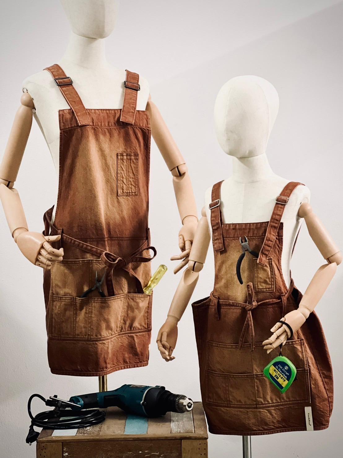 Carpenter denim tool apron in copper with buckle straps, adult and child set